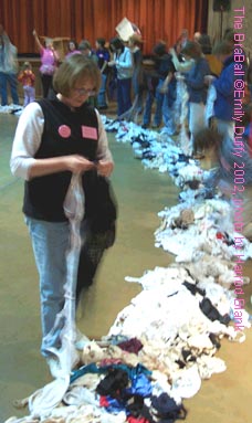 Helper stringing bras together